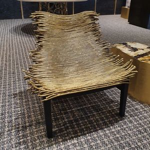 Savane armchair, Armchair with decorative seat in brass