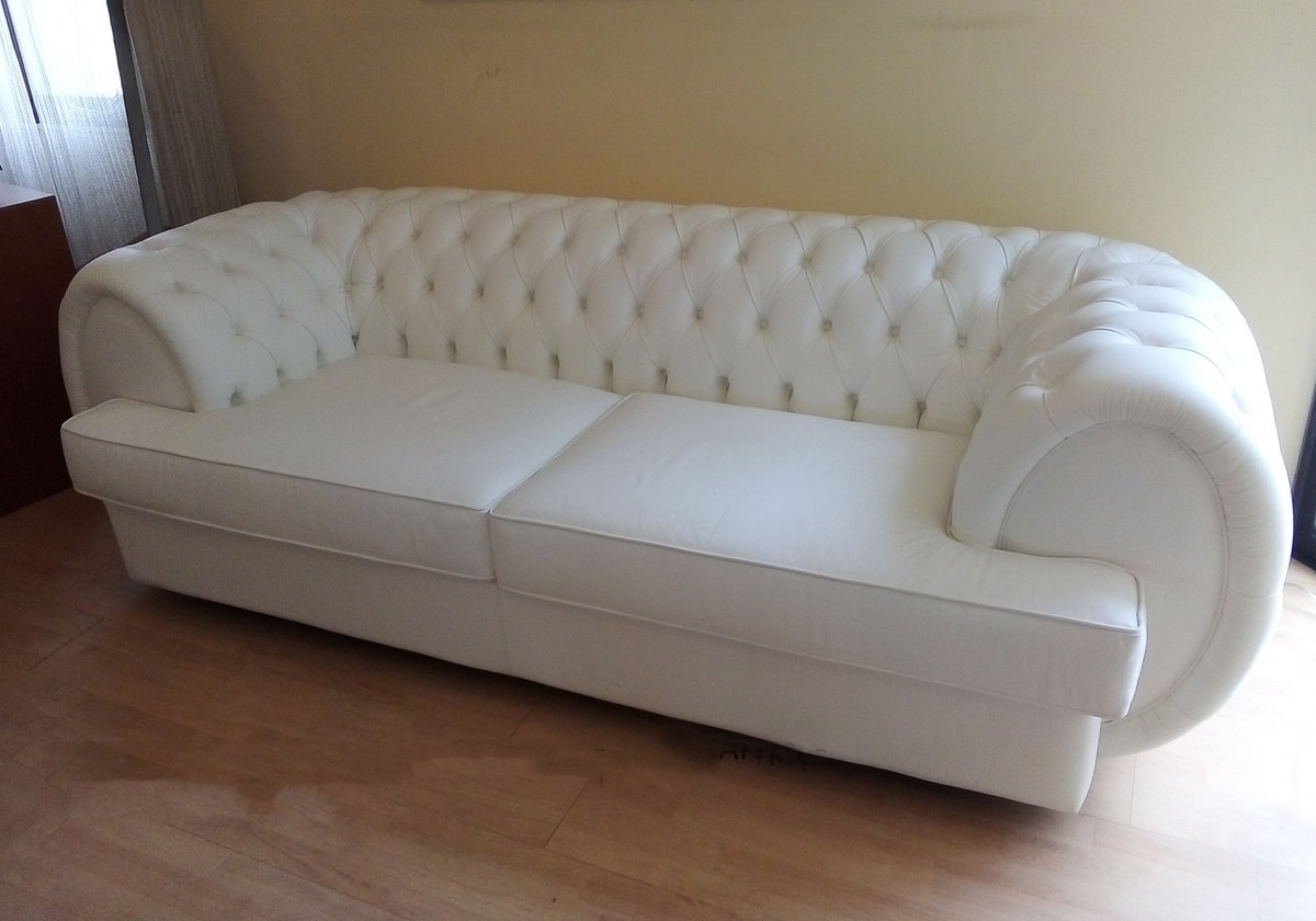 white leather tufted sofa
